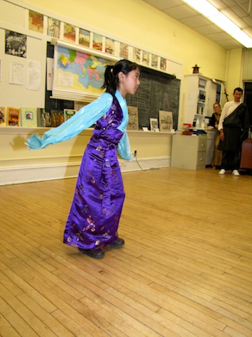 Young Tibetan girl performs a traditional dance at the Halifax Shambhala School.